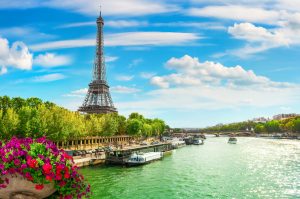 Eiffel Tower next to the Seine river in Paris - Leisure Travel Enterprises