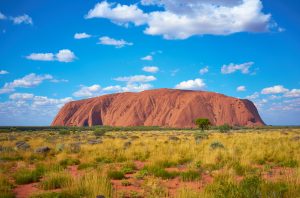 Uluru, Northern Territory, Australia with blue sky overhead - Leisure Travel Enterprises 