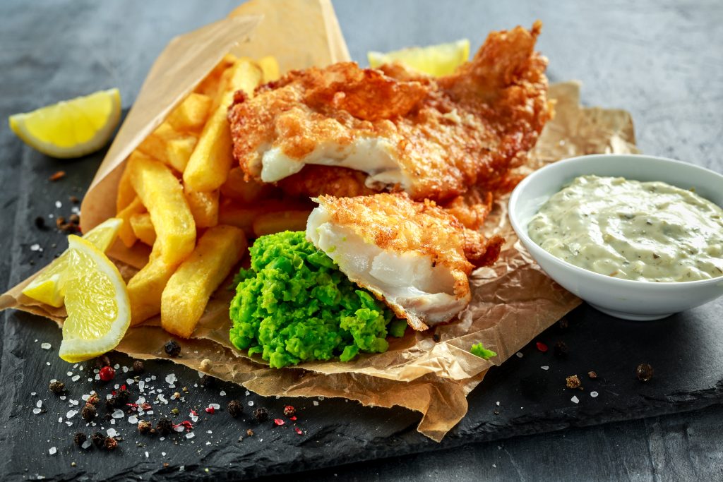 British Traditional Fish and chips with mashed peas, tartar sauce - Leisure Travel Enterprises