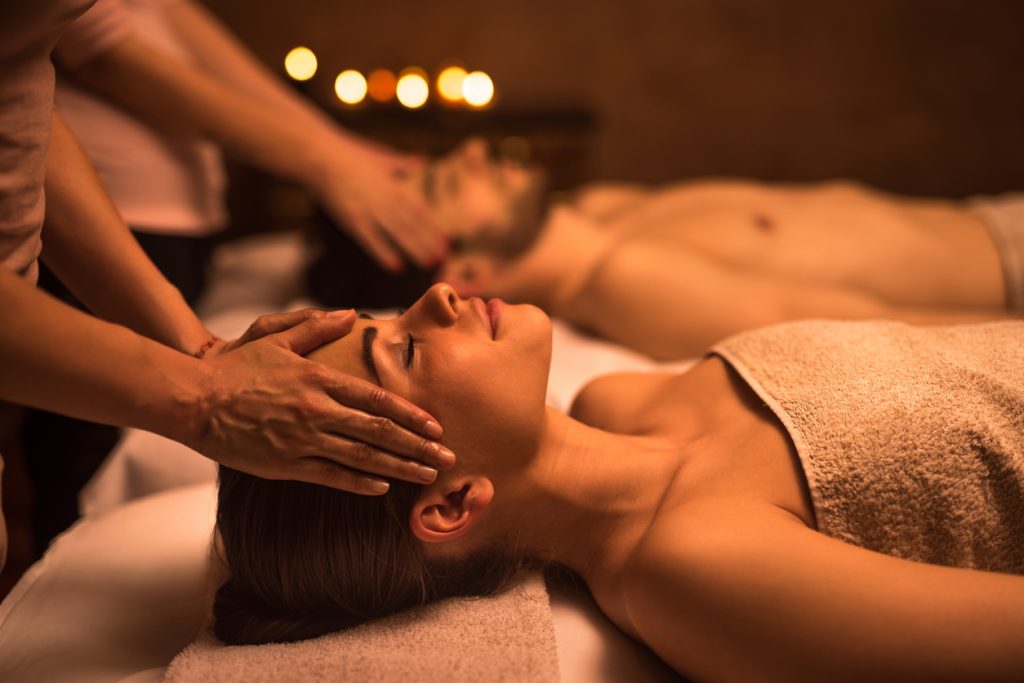 Young woman at the spa enjoying in head massage - Leisure Travel Enterprises 