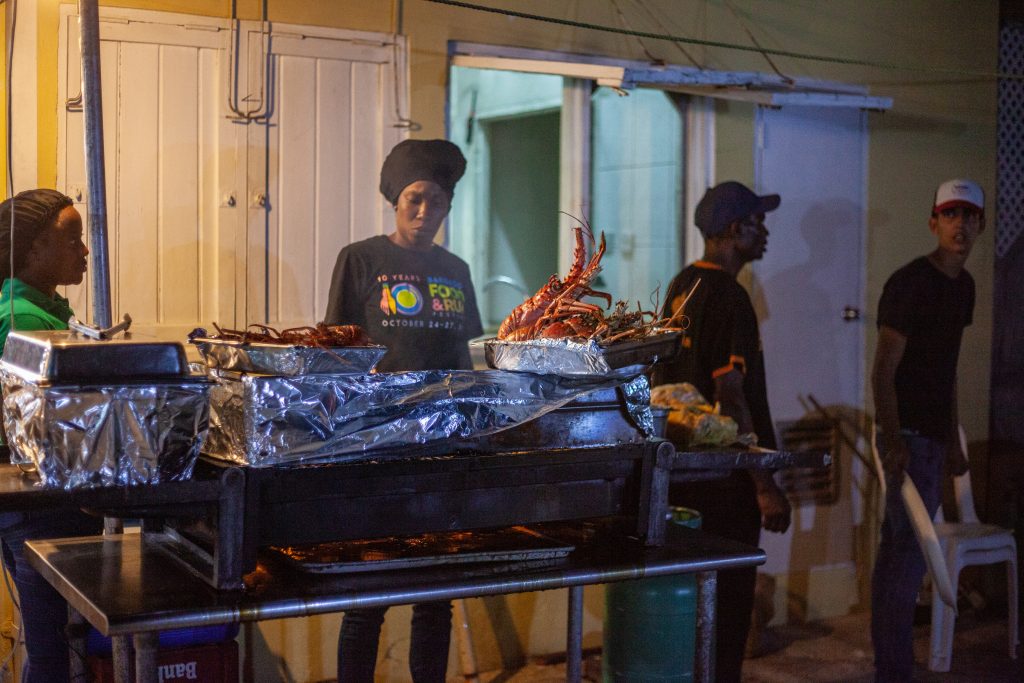 People enjoying the Friday Night Fish Fry at Oistins in Barbados on a warm Friday night